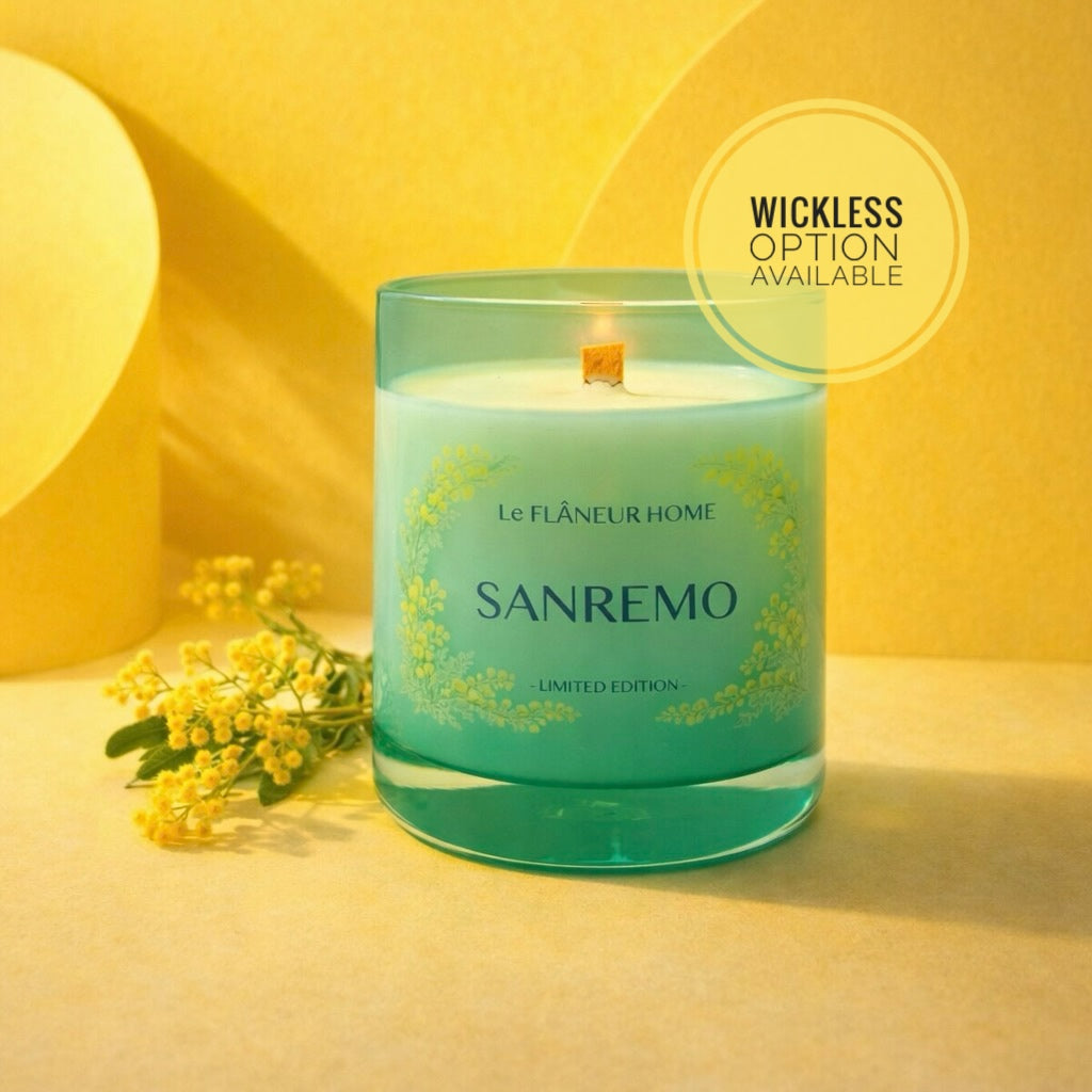 Green candle labeled 'Sanremo' with floral elements on a yellow background
