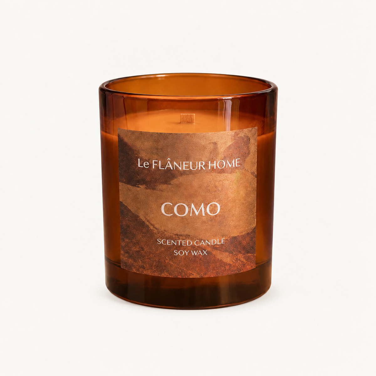 Como Scented Candle by Le Flâneur Home, unlit on an ivory background.