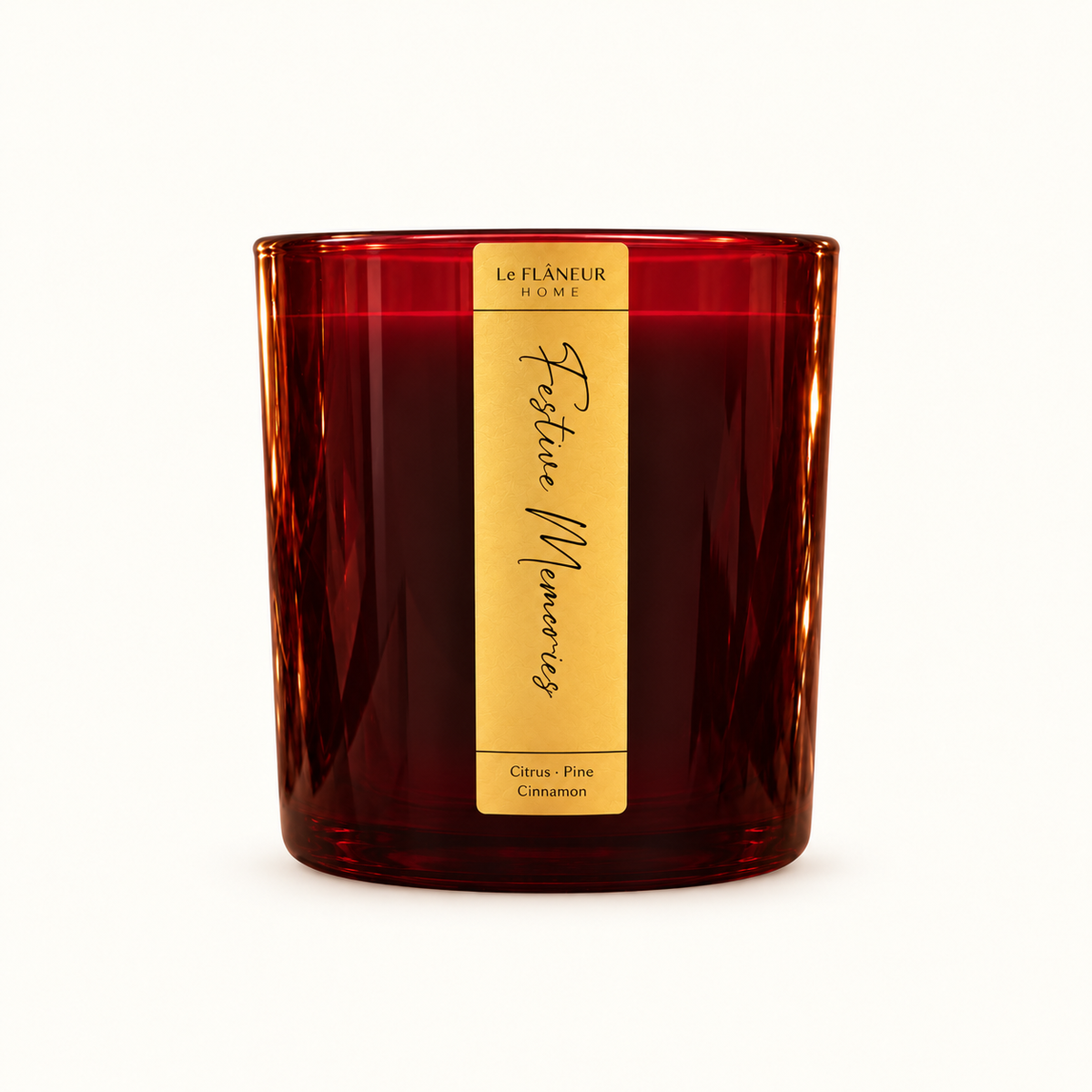 Festive Memories Scented Candle by Le Flâneur Home, unlit on an ivory background.