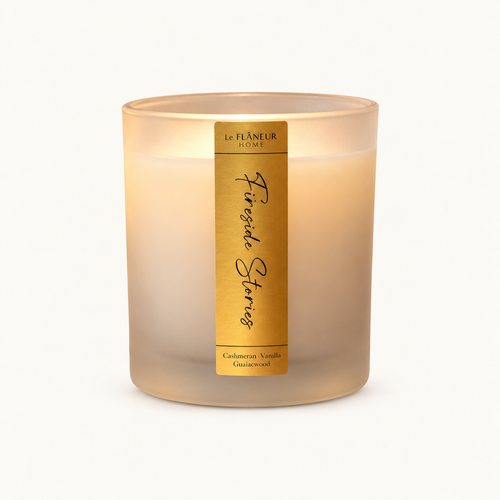 Fireside Stories Scented Candle by Le Flâneur Home, unlit on an ivory background.