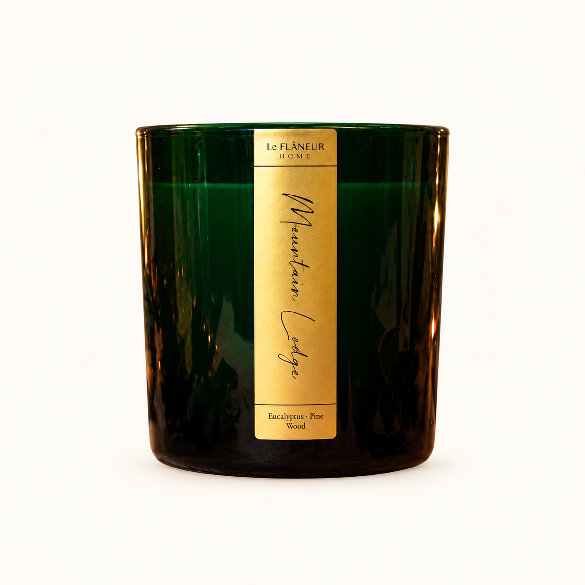 Mountain Lodge Scented Candle by Le Flâneur Home, unlit on an ivory background.