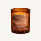 Positano Scented Candle by Le Flâneur Home, unlit on an ivory background.